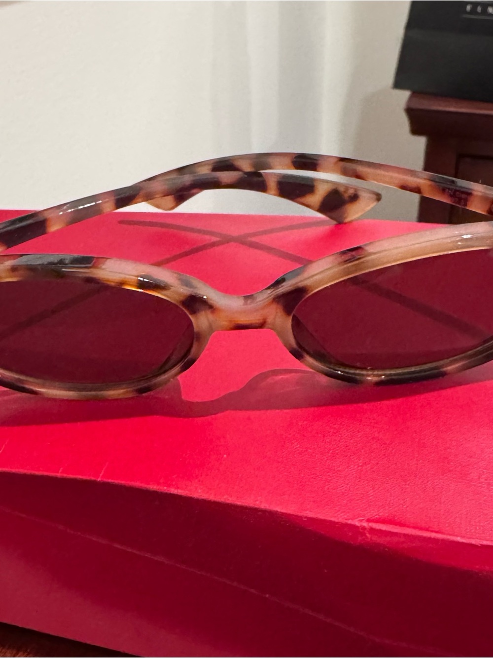 Tortoiseshell Oval Sunglasses with Dark Lenses